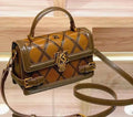 Elegant Brown Leather Handbag with Gold Emblem